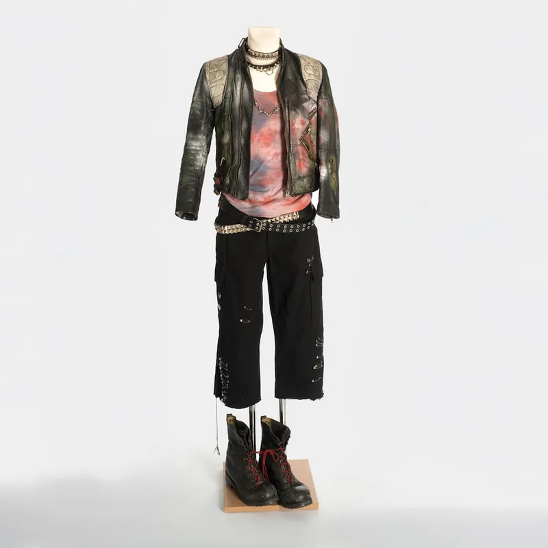 Rebellious scene style: Punk-inspired men`s fashion with leather jacket and studs